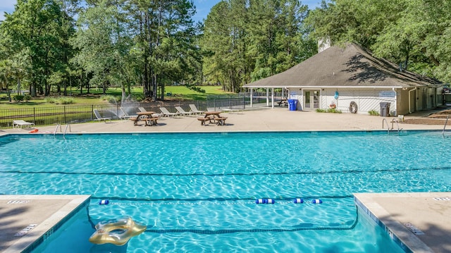 7945 Parklane Ct Unit C, North Charleston, SC 29418 - community pool with a patio area and view of wooded area
