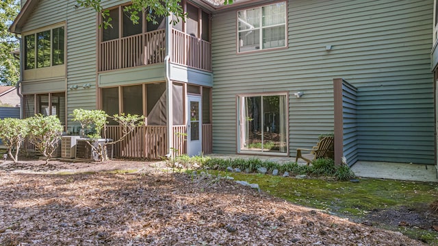 7945 Parklane Ct Unit C, North Charleston, SC 29418 - back of house featuring a sunroom and central AC unit