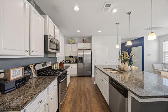 153 Wild Holly Dr, Moncks Corner, SC 29461 - kitchen with appliances with stainless steel finishes, a sink, white cabinets, dark wood-style floors, and recessed lighting