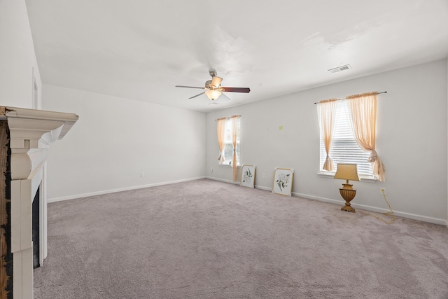 153 Wild Holly Dr, Moncks Corner, SC 29461 - unfurnished living room featuring a ceiling fan, baseboards, and carpet flooring