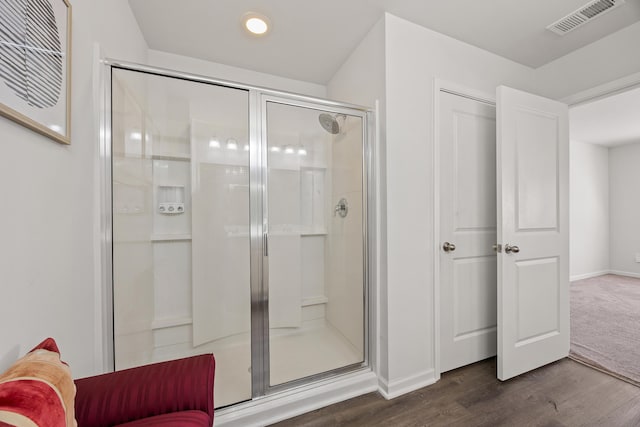 153 Wild Holly Dr, Moncks Corner, SC 29461 - full bathroom featuring wood finished floors, a shower stall, and baseboards