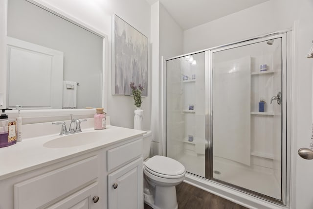 153 Wild Holly Dr, Moncks Corner, SC 29461 - full bathroom with a stall shower, toilet, wood finished floors, and vanity