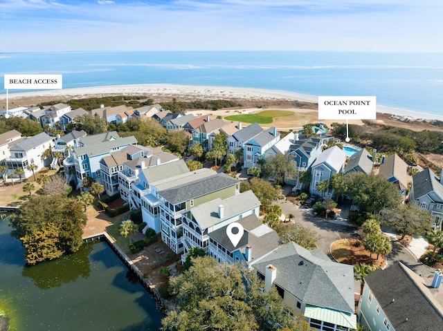 birds eye view of property featuring a water view and a residential view