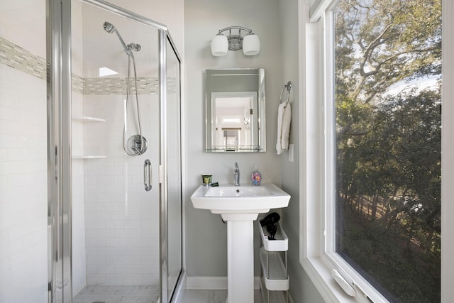 bathroom featuring a shower stall