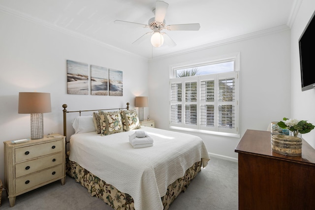 bedroom with light carpet, ceiling fan, ornamental molding, and baseboards