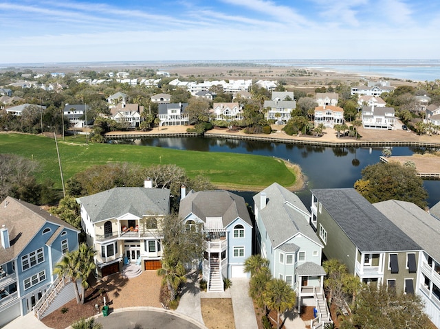 birds eye view of property featuring a water view and a residential view