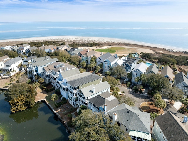 drone / aerial view featuring a water view and a residential view