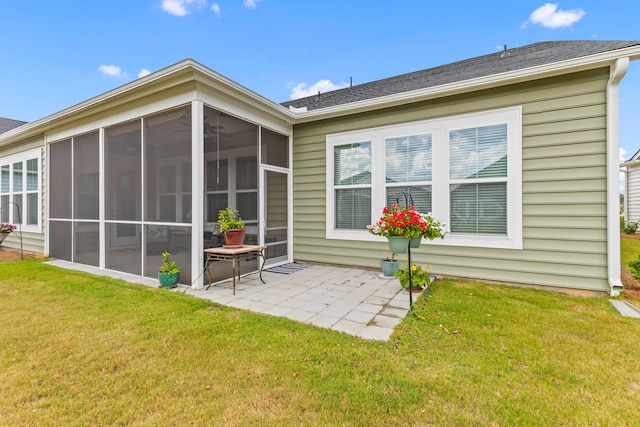 1107 Bellwether Ln, Summerville, SC 29485 - back of house with a sunroom, a patio area, a yard, and roof with shingles
