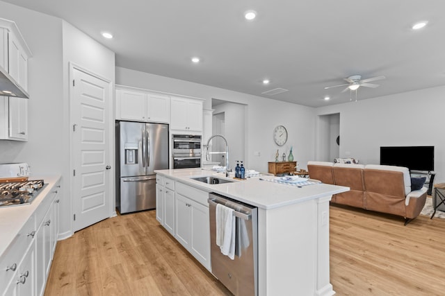 1107 Bellwether Ln, Summerville, SC 29485 - kitchen with stainless steel appliances, light wood finished floors, ceiling fan, white cabinets, and recessed lighting