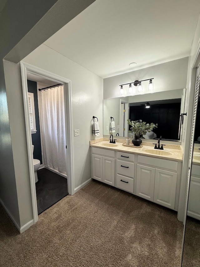 bathroom with vanity and toilet