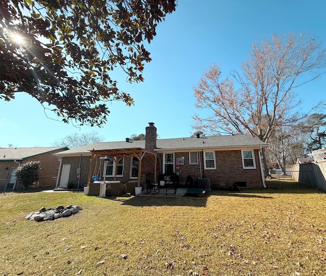 back of property with a yard, a patio, and cooling unit