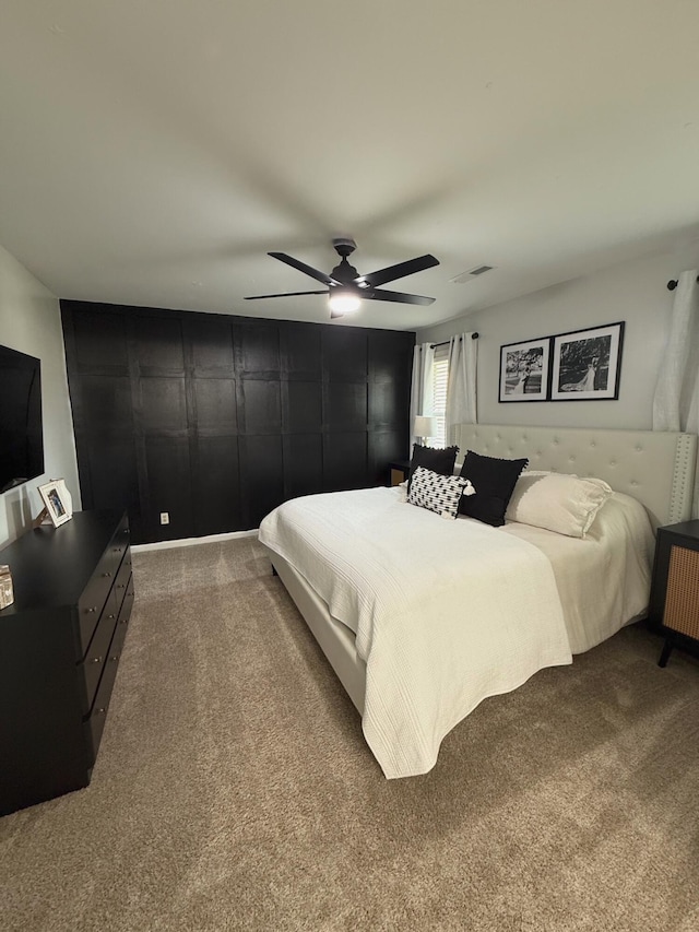 carpeted bedroom with ceiling fan