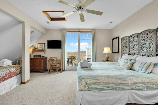 bedroom featuring visible vents, carpet floors, attic access, and access to exterior