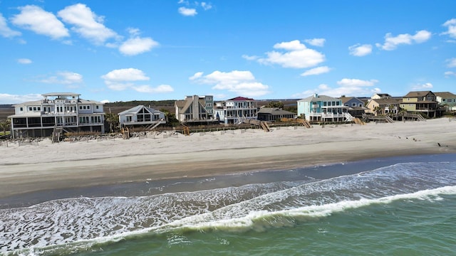 water view featuring a view of the beach and a residential view