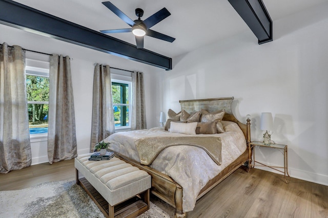 bedroom with ceiling fan and light wood-type flooring