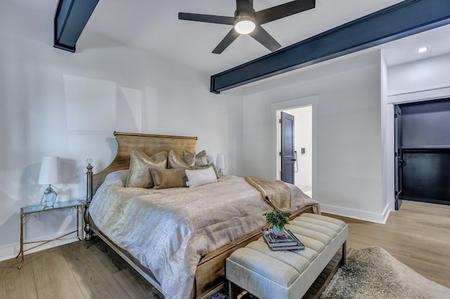 bedroom featuring ceiling fan and light hardwood / wood-style flooring