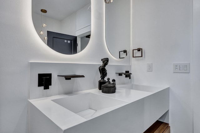 bathroom featuring vanity and hardwood / wood-style flooring