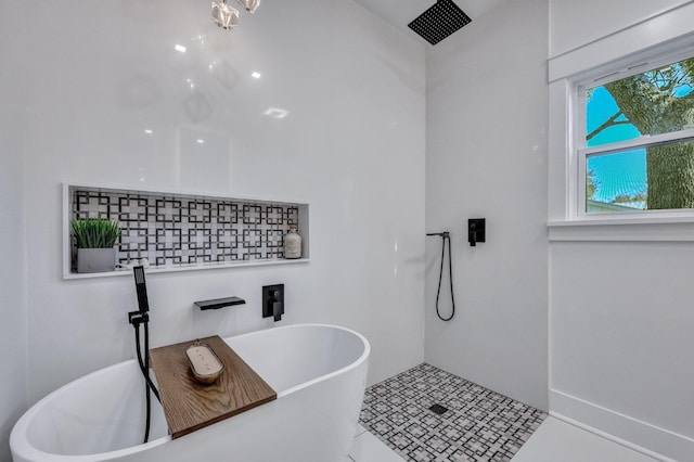 bathroom featuring tile patterned floors and shower with separate bathtub