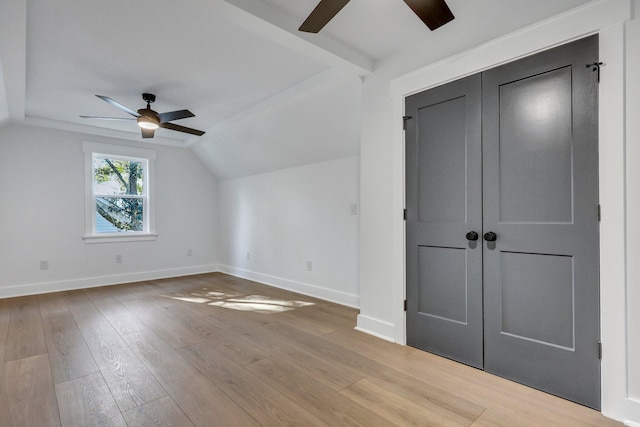 additional living space featuring light hardwood / wood-style floors, ceiling fan, and lofted ceiling