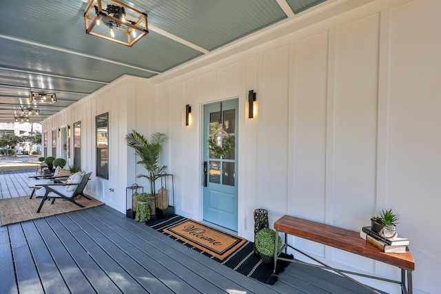 wooden terrace featuring covered porch