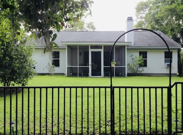 3415 Pawtucket St, Charleston, SC 29414 - rear view of house with a sunroom, a shingled roof, and a chimney