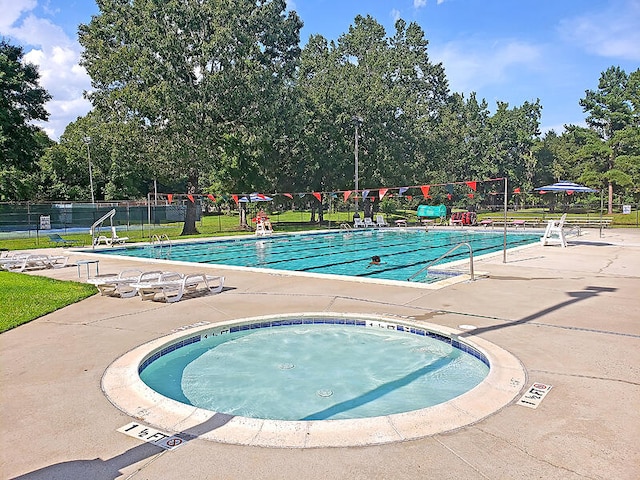 view of swimming pool featuring a patio area