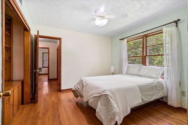 1900 Morgan Ave, North Charleston, SC 29406 - bedroom featuring light wood-style floors and a textured ceiling
