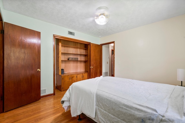 1900 Morgan Ave, North Charleston, SC 29406 - bedroom with light wood-style flooring and a textured ceiling