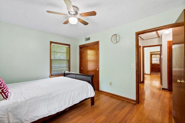 1900 Morgan Ave, North Charleston, SC 29406 - bedroom with wood-type flooring, a closet, a ceiling fan, and attic access
