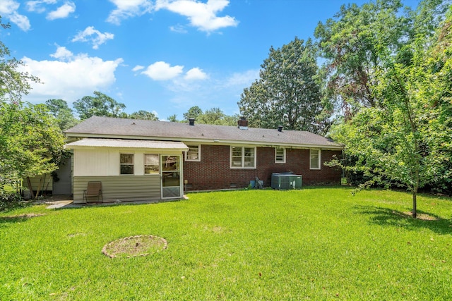 1900 Morgan Ave, North Charleston, SC 29406 - rear view of property featuring a lawn, brick siding, and a chimney