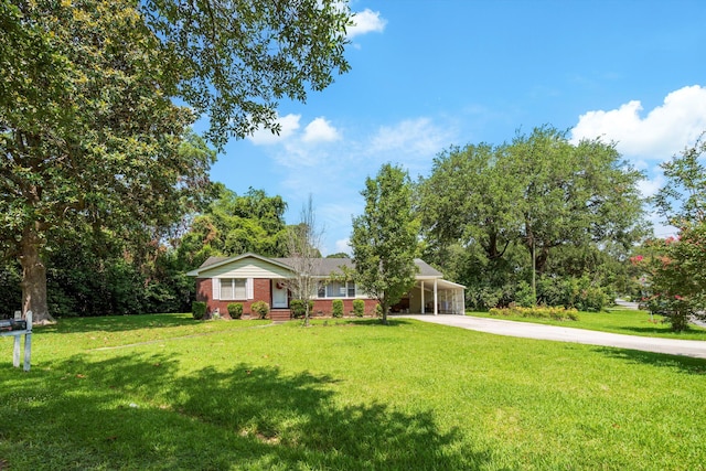 1900 Morgan Ave, North Charleston, SC 29406 - ranch-style home with concrete driveway, a front lawn, a carport, and brick siding