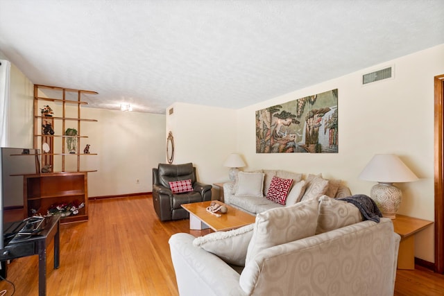 1900 Morgan Ave, North Charleston, SC 29406 - living area featuring wood finished floors and a textured ceiling