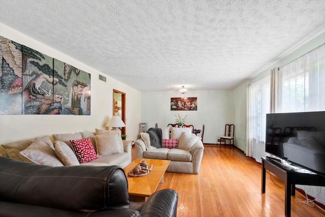 1900 Morgan Ave, North Charleston, SC 29406 - living area featuring light wood-style floors and a textured ceiling