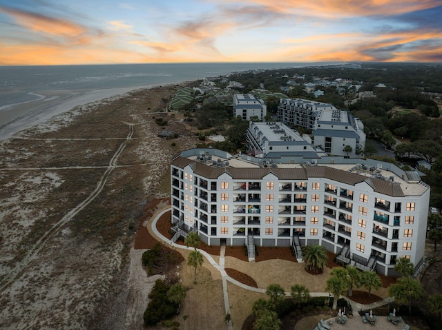 aerial view at dusk with a water view