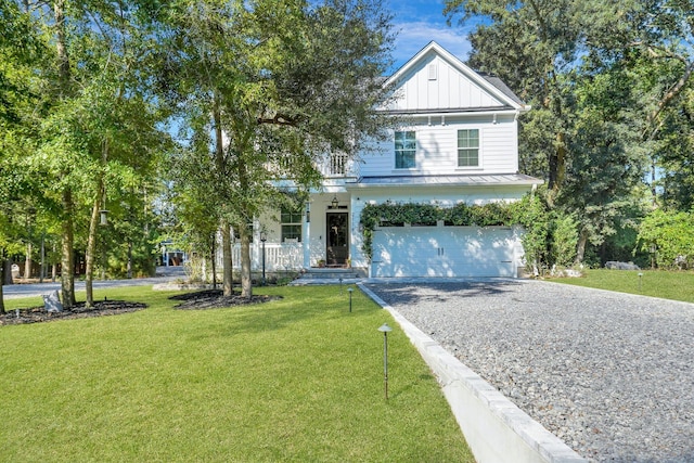 view of front of home featuring a front yard and a garage