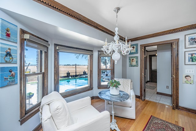 interior space with an inviting chandelier and light hardwood / wood-style floors