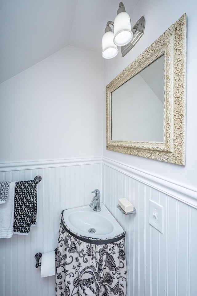 bathroom with sink and vaulted ceiling