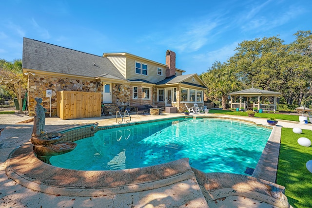 view of swimming pool with a gazebo and a patio area