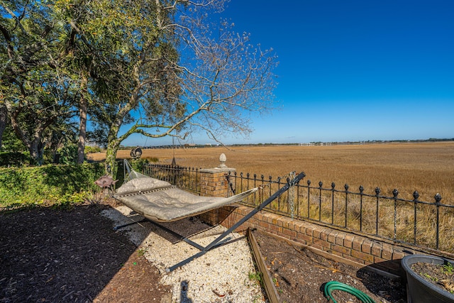 view of yard with a rural view