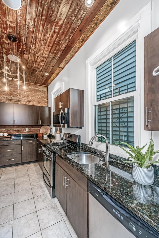 173 Fishburne St, Charleston, SC 29403 - kitchen featuring stainless steel appliances, a sink, wooden ceiling, dark brown cabinets, and dark stone counters
