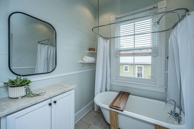 173 Fishburne St, Charleston, SC 29403 - bathroom with a freestanding bath, vanity, tile patterned flooring, and curtained shower
