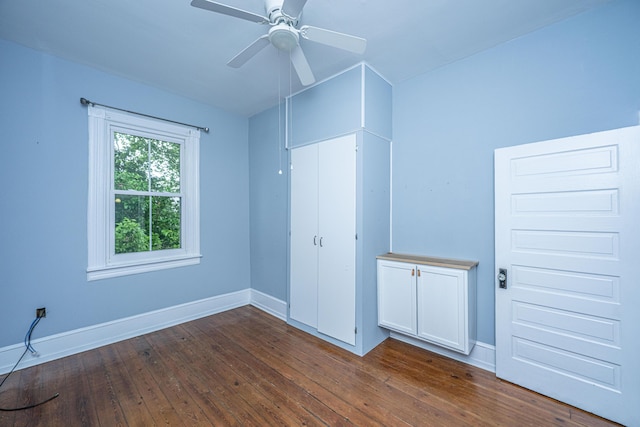 173 Fishburne St, Charleston, SC 29403 - unfurnished bedroom featuring dark wood-style flooring, baseboards, a closet, and a ceiling fan