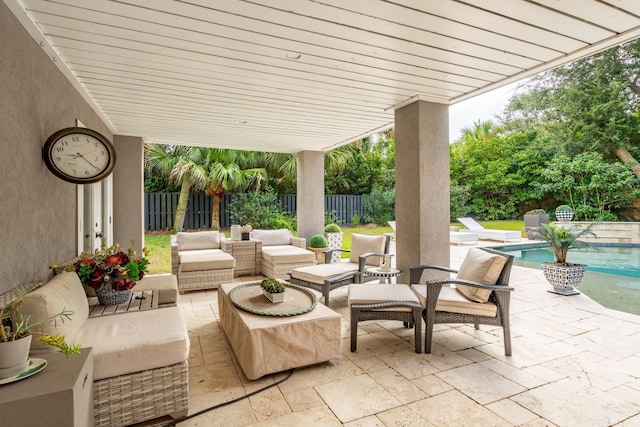 view of patio featuring a fenced in pool and an outdoor living space