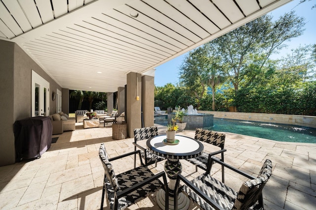 view of patio featuring pool water feature and an outdoor hangout area