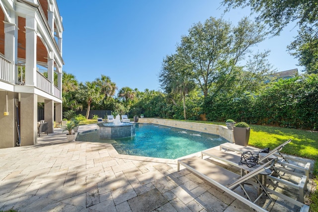 view of swimming pool with a patio