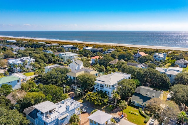 bird's eye view featuring a water view and a beach view