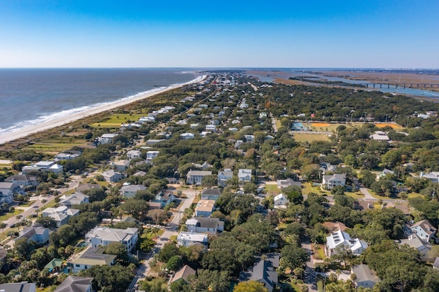 drone / aerial view with a water view and a beach view