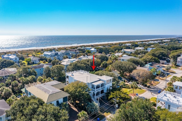 aerial view with a water view and a view of the beach