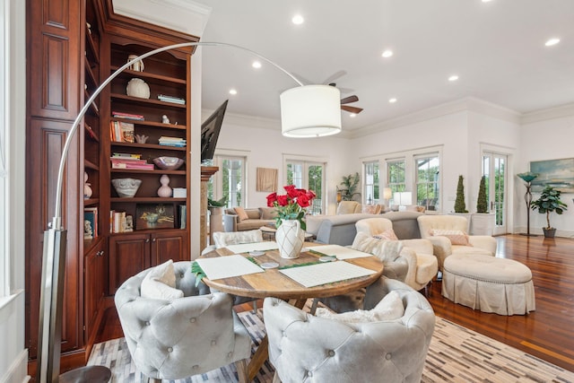 dining area with ceiling fan, light hardwood / wood-style flooring, and crown molding