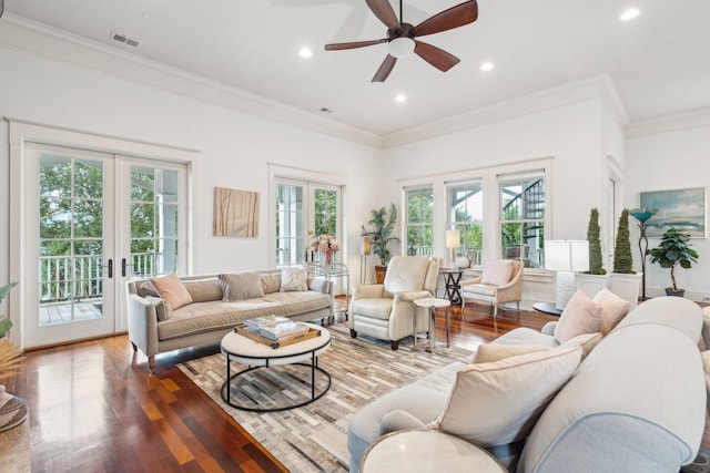 living room featuring french doors, ceiling fan, and a healthy amount of sunlight